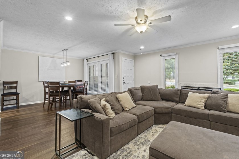 Welcome to this inviting end-unit townhome nestled in the highly - photo 17