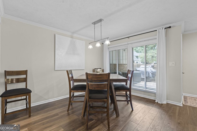 Welcome to this inviting end-unit townhome nestled in the highly - photo 18