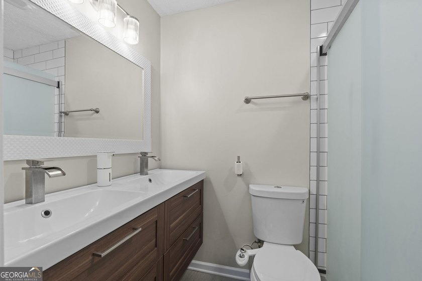 Welcome to this inviting end-unit townhome nestled in the highly - photo 33