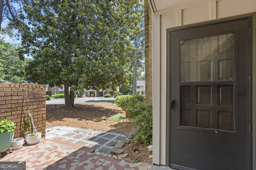 Welcome to this inviting end-unit townhome nestled in the highly - photo 38