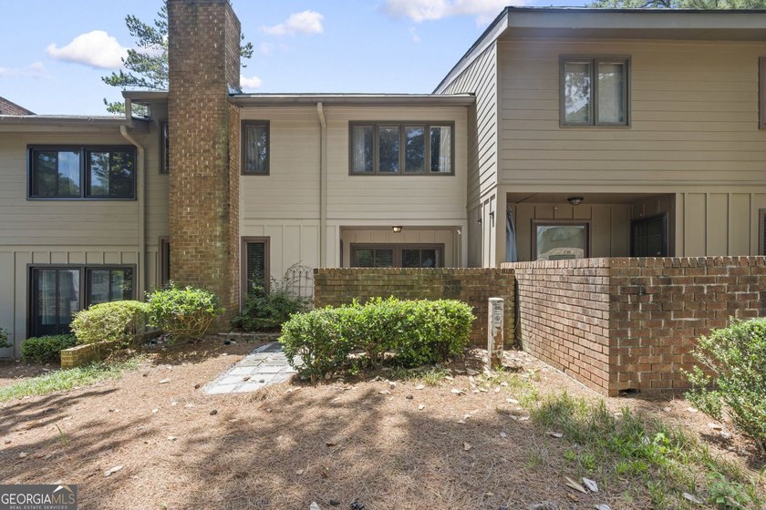 Welcome to this inviting end-unit townhome nestled in the highly - photo 40