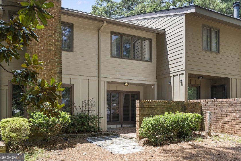 Welcome to this inviting end-unit townhome nestled in the highly - photo 42