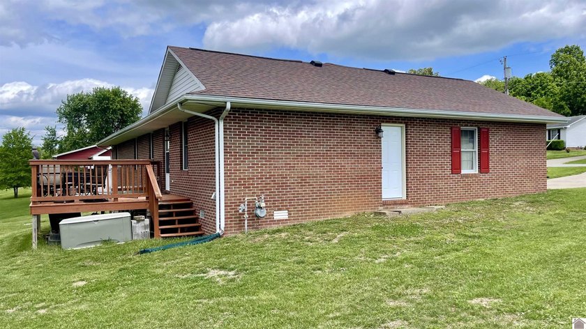 Welcome to beautiful 401 Centennial Drive: a spacious brick - photo 8