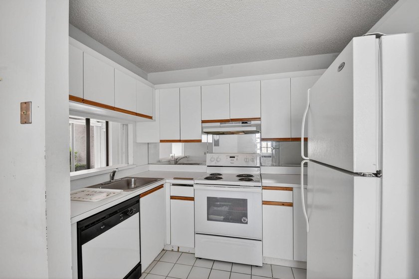 Create your own masterpiece in this spacious first floor lake - photo 11