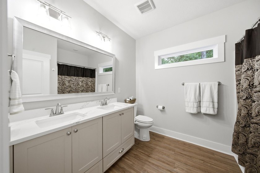 Built just three years ago, this stunning custom lakefront home - photo 11