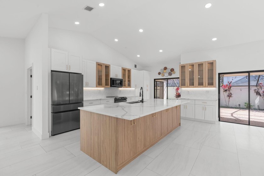 Welcome to refined living in this impeccably upgraded 3-bedroom - photo 5