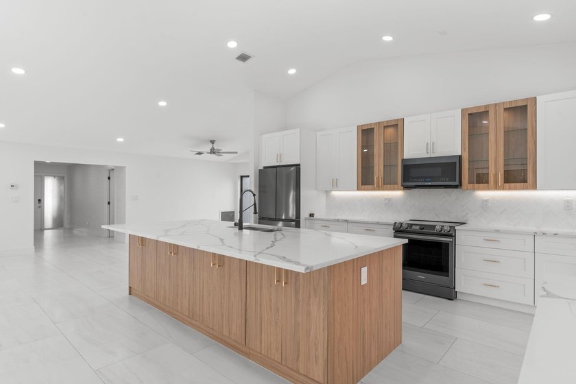 Welcome to refined living in this impeccably upgraded 3-bedroom - photo 9