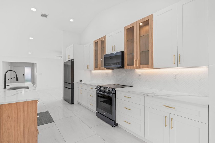 Welcome to refined living in this impeccably upgraded 3-bedroom - photo 10