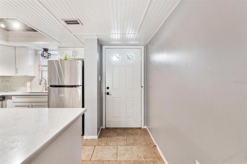 The open-concept layout comes mostly furnished and features an - photo 11