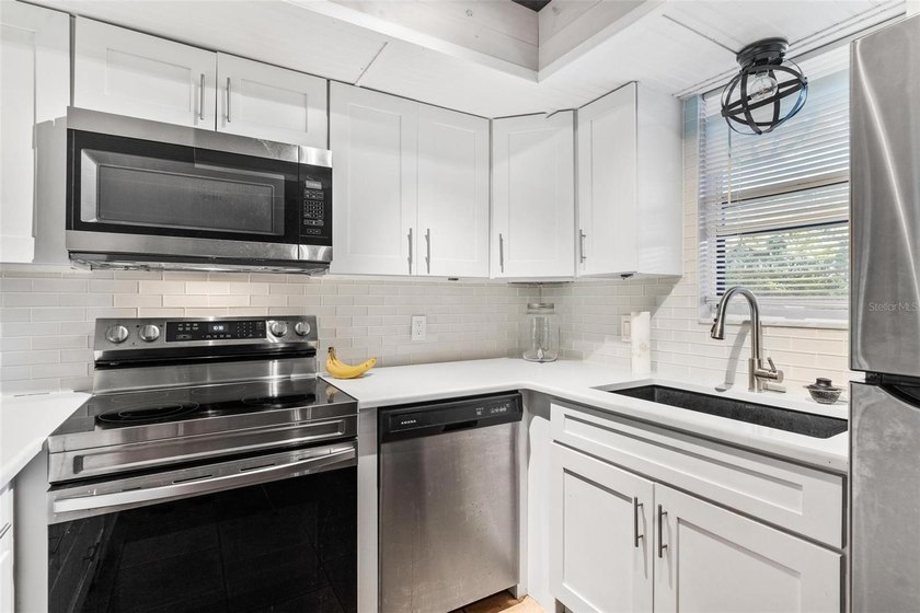 The open-concept layout comes mostly furnished and features an - photo 16
