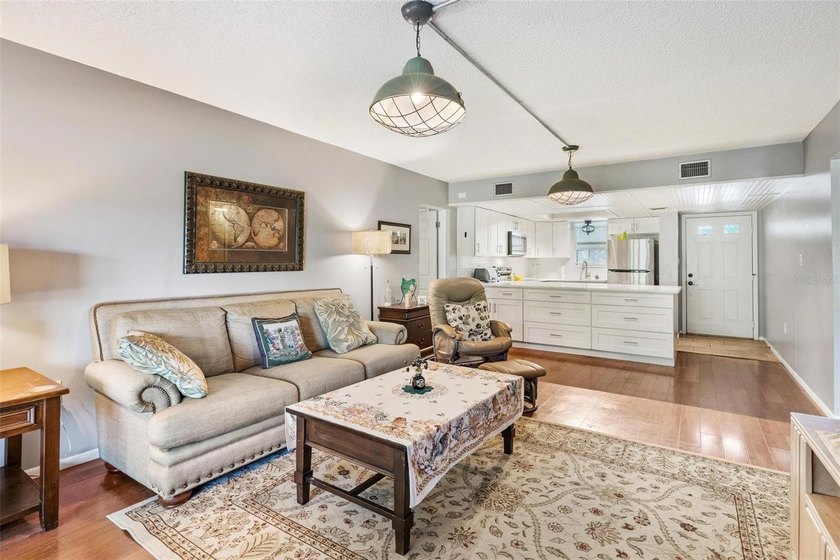The open-concept layout comes mostly furnished and features an - photo 18