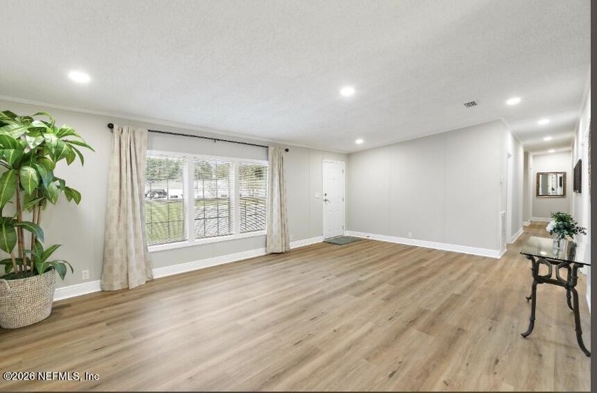 This gorgeous 5 bedroom, 3 full bath home is located an acre! In - photo 3