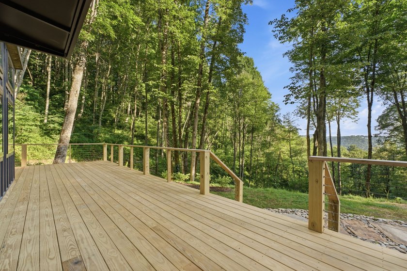 Perched on 1.12 private acres, this custom-built Timbercraft - photo 11