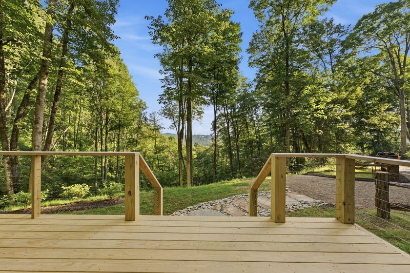 Perched on 1.12 private acres, this custom-built Timbercraft - photo 12