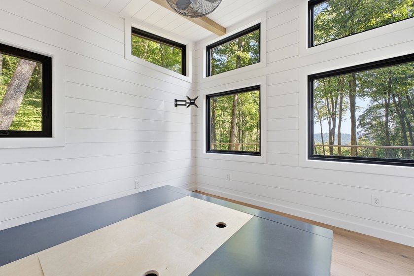 Perched on 1.12 private acres, this custom-built Timbercraft - photo 26