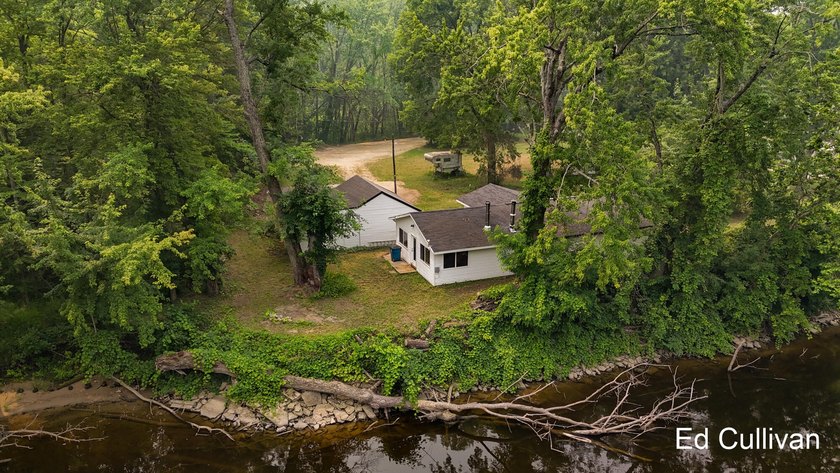 Enjoy the best of Muskegon River living with this updated - photo 5