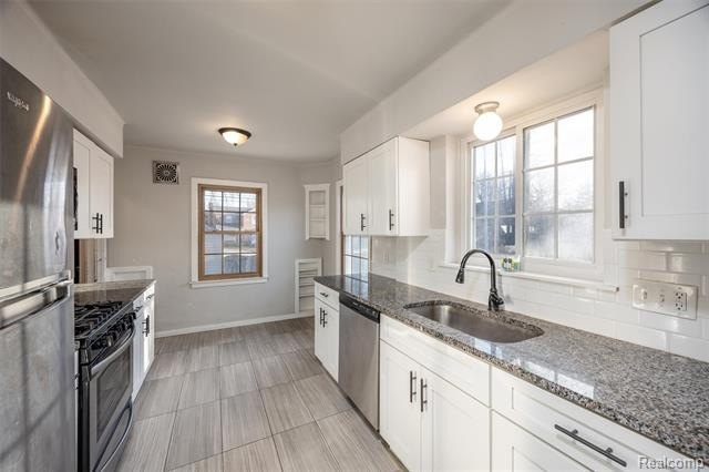 Welcome Home ! This brick bungalow offers an oversized primary - photo 3