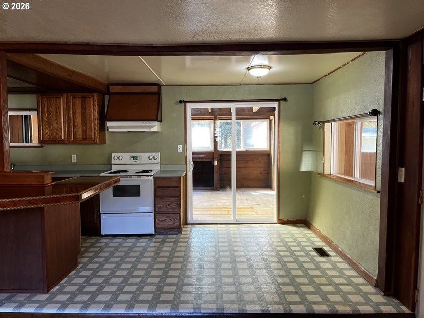 This charming 2-bedroom, 1-bath manufactured home sits on a - photo 12