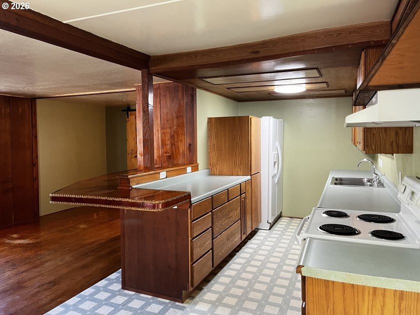 This charming 2-bedroom, 1-bath manufactured home sits on a - photo 14