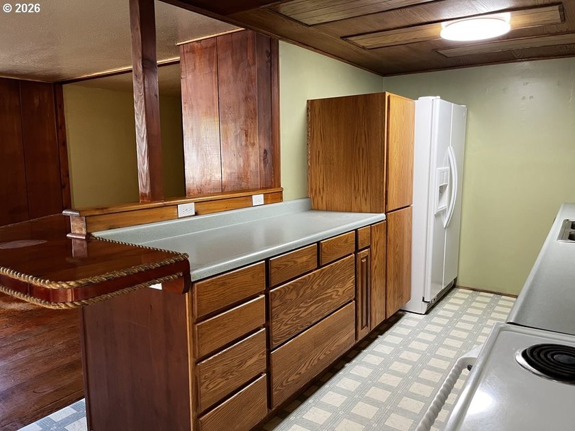 This charming 2-bedroom, 1-bath manufactured home sits on a - photo 16