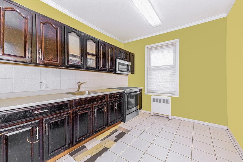 Welcome to 4101 Paulding Avenue, a charming brick single-family - photo 21