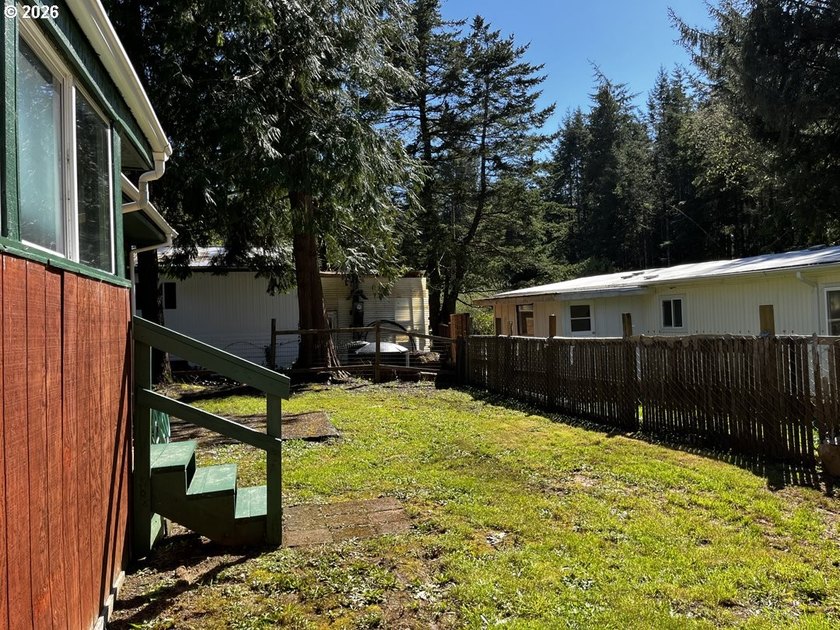 This charming 2-bedroom, 1-bath manufactured home sits on a - photo 37