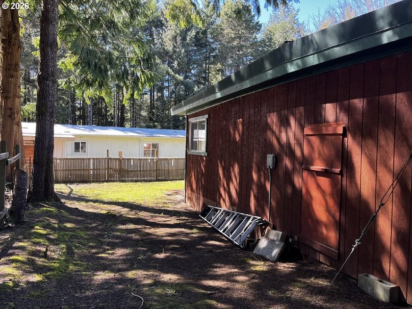 This charming 2-bedroom, 1-bath manufactured home sits on a - photo 42
