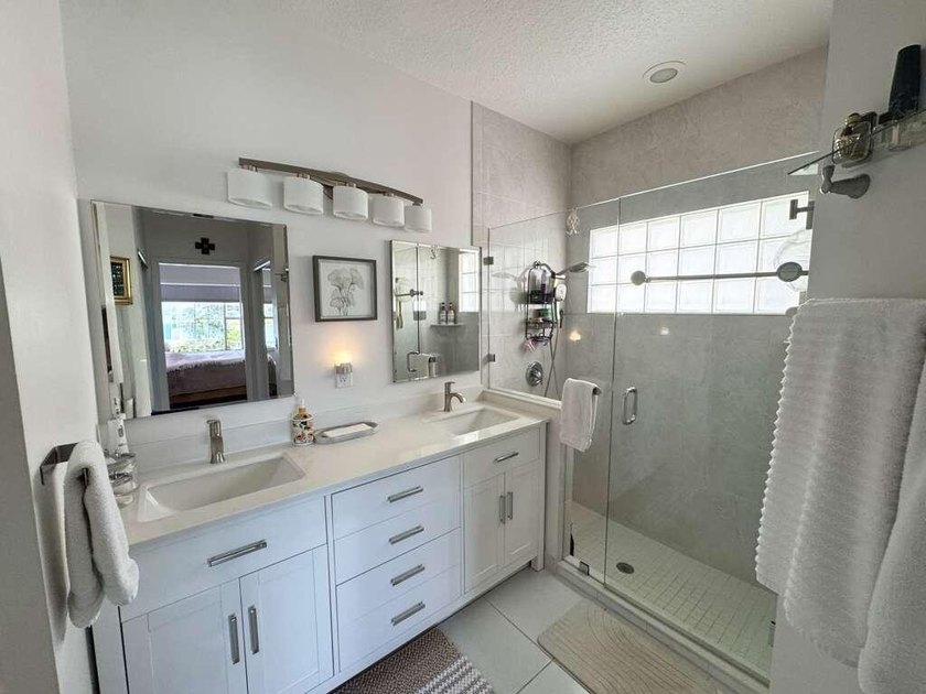 Beautifully updated lakefront home featuring a 2023 roof, impact - photo 11