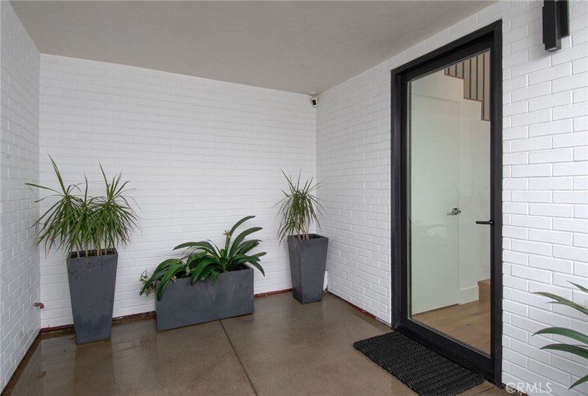 Tucked away on a coveted street south of PCH, this exceptional - photo 2
