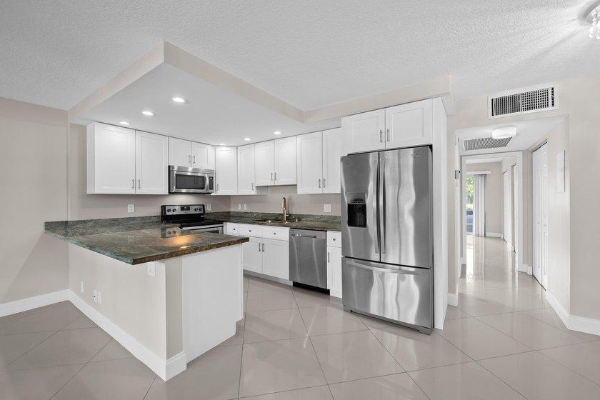 Enjoy peaceful lake and fountain views from this beautifully - photo 2