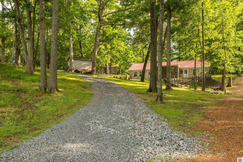 Kentucky Lake retreat with year-round water offering the perfect - photo 7