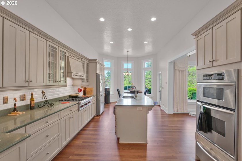 Tucked away on over an acre of wooded privacy, this custom - photo 9