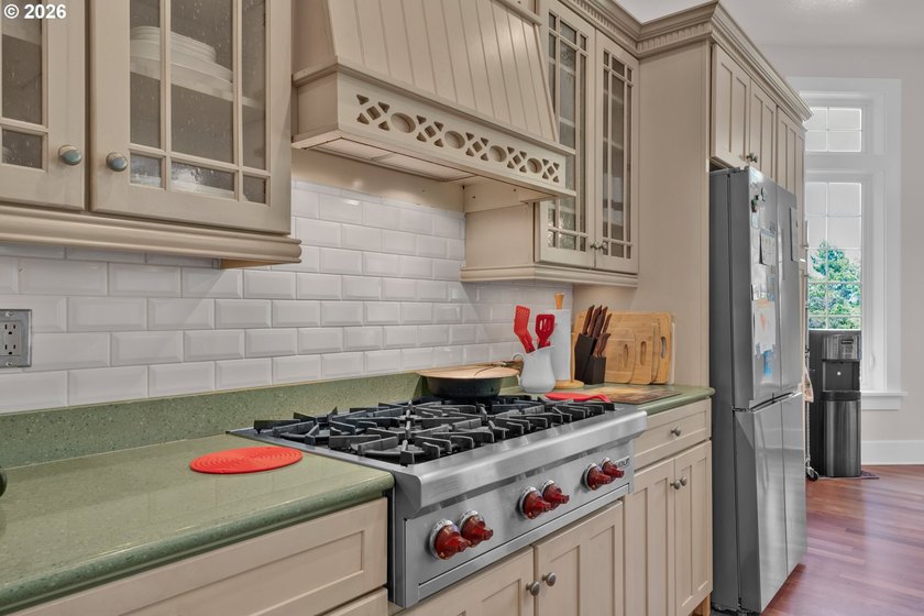 Tucked away on over an acre of wooded privacy, this custom - photo 10
