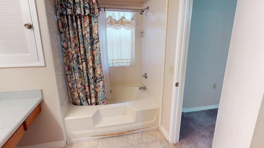 This 3-bedroom, 2-bath home with an attached 1-car garage is - photo 11
