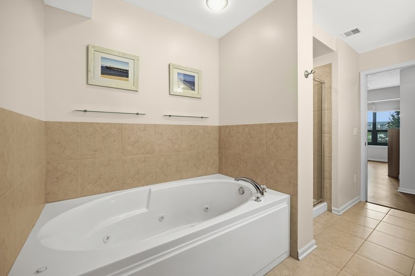 This move-in-ready luxury condo offers the perfect blend of - photo 12