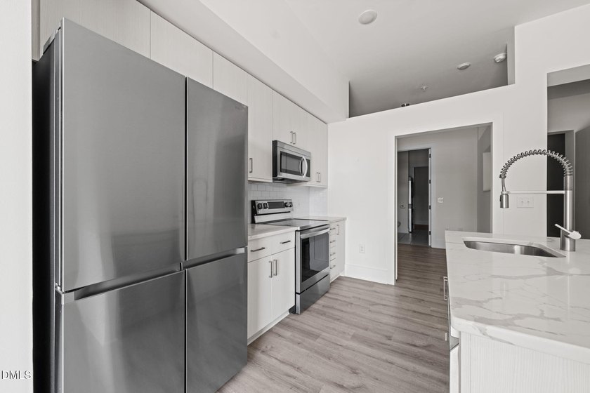 Hidden gem on Centennial Campus! This first-floor condo offers - photo 11
