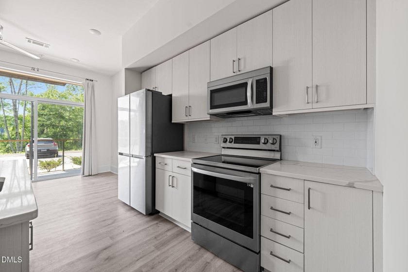 Hidden gem on Centennial Campus! This first-floor condo offers - photo 13