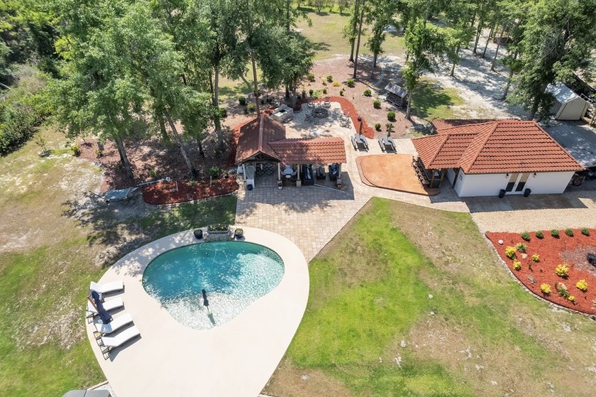 Situated on nearly 5 private acres, this exceptional estate - photo 11
