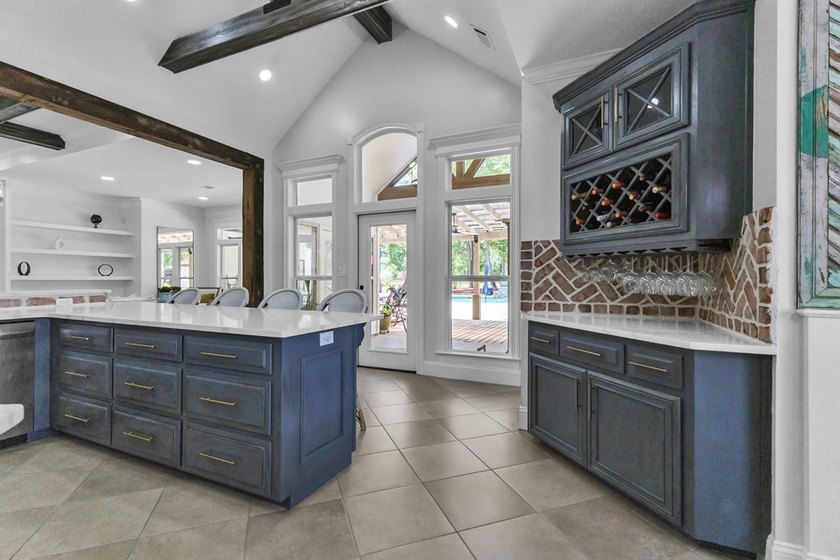 Situated on nearly 5 private acres, this exceptional estate - photo 29