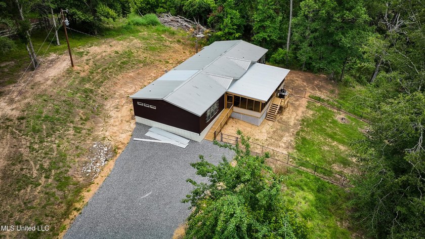 Hilltop Residence and new doublewide overlook a stocked lake and - photo 10