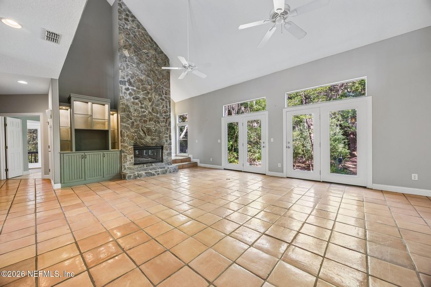 Nestled beneath a canopy of majestic live oaks and surrounded by - photo 11