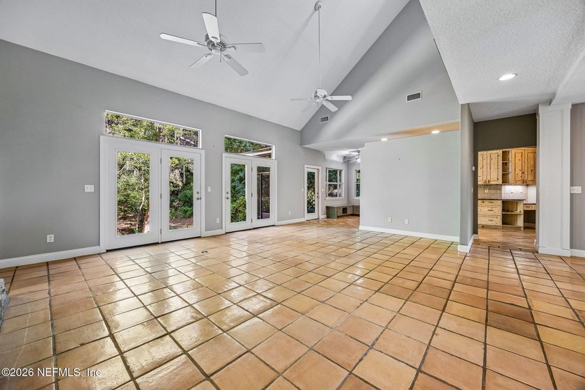 Nestled beneath a canopy of majestic live oaks and surrounded by - photo 12