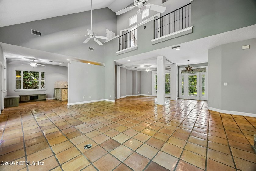 Nestled beneath a canopy of majestic live oaks and surrounded by - photo 13