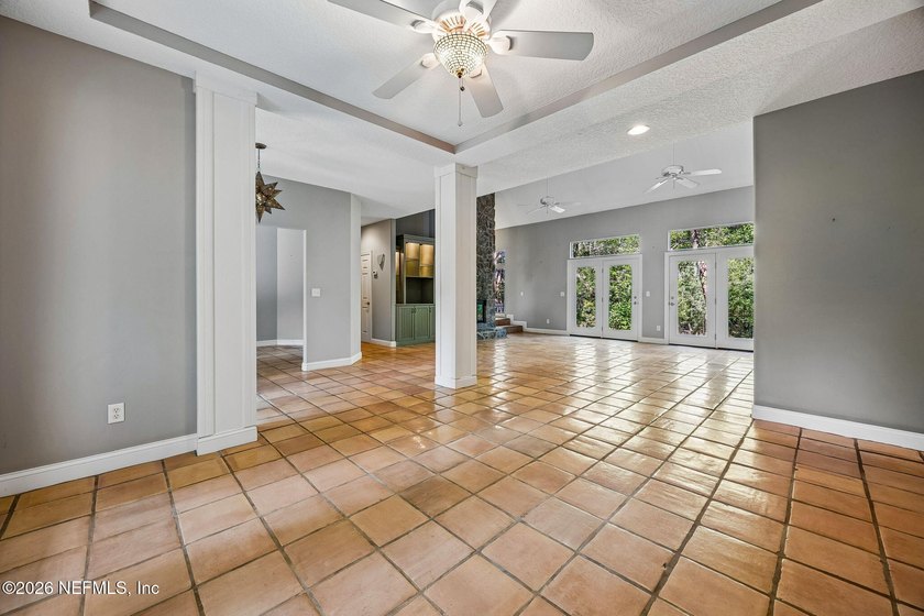 Nestled beneath a canopy of majestic live oaks and surrounded by - photo 14