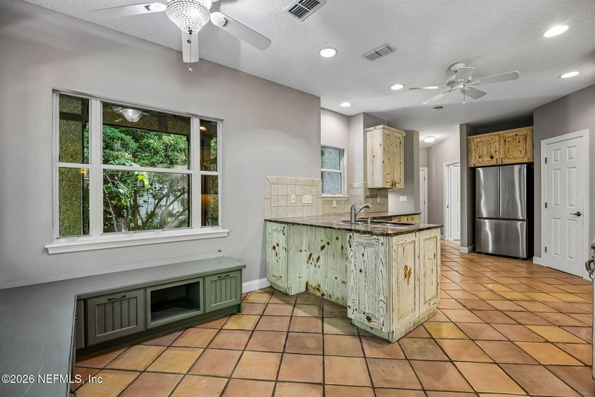 Nestled beneath a canopy of majestic live oaks and surrounded by - photo 18