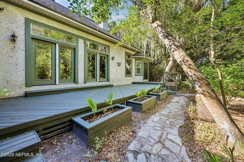 Nestled beneath a canopy of majestic live oaks and surrounded by - photo 22
