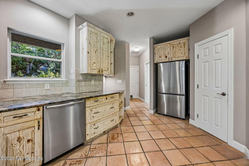 Nestled beneath a canopy of majestic live oaks and surrounded by - photo 23