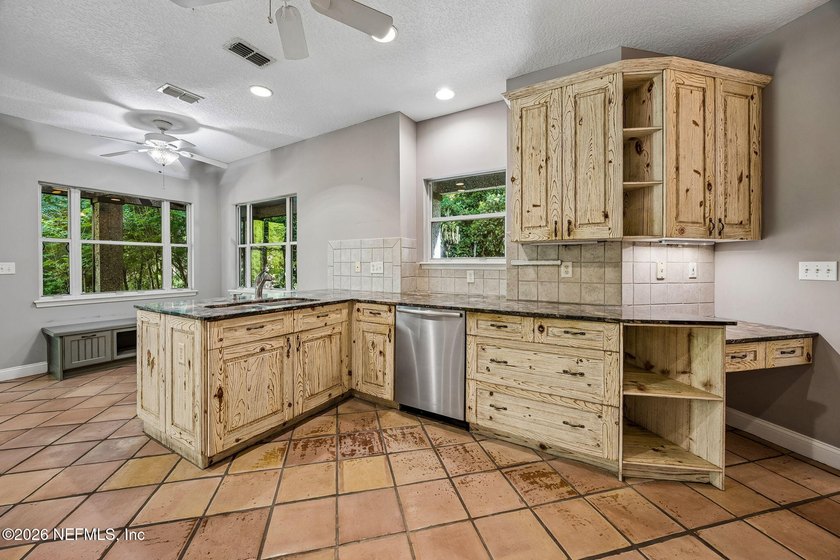 Nestled beneath a canopy of majestic live oaks and surrounded by - photo 24