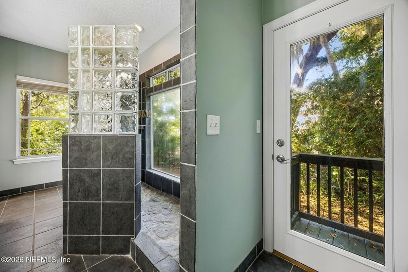 Nestled beneath a canopy of majestic live oaks and surrounded by - photo 30