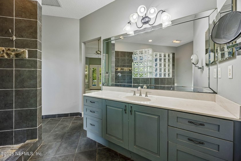 Nestled beneath a canopy of majestic live oaks and surrounded by - photo 31